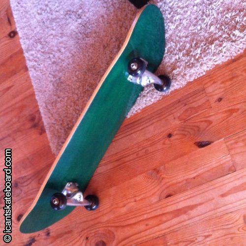 Home made skateboard with mini logo trucks